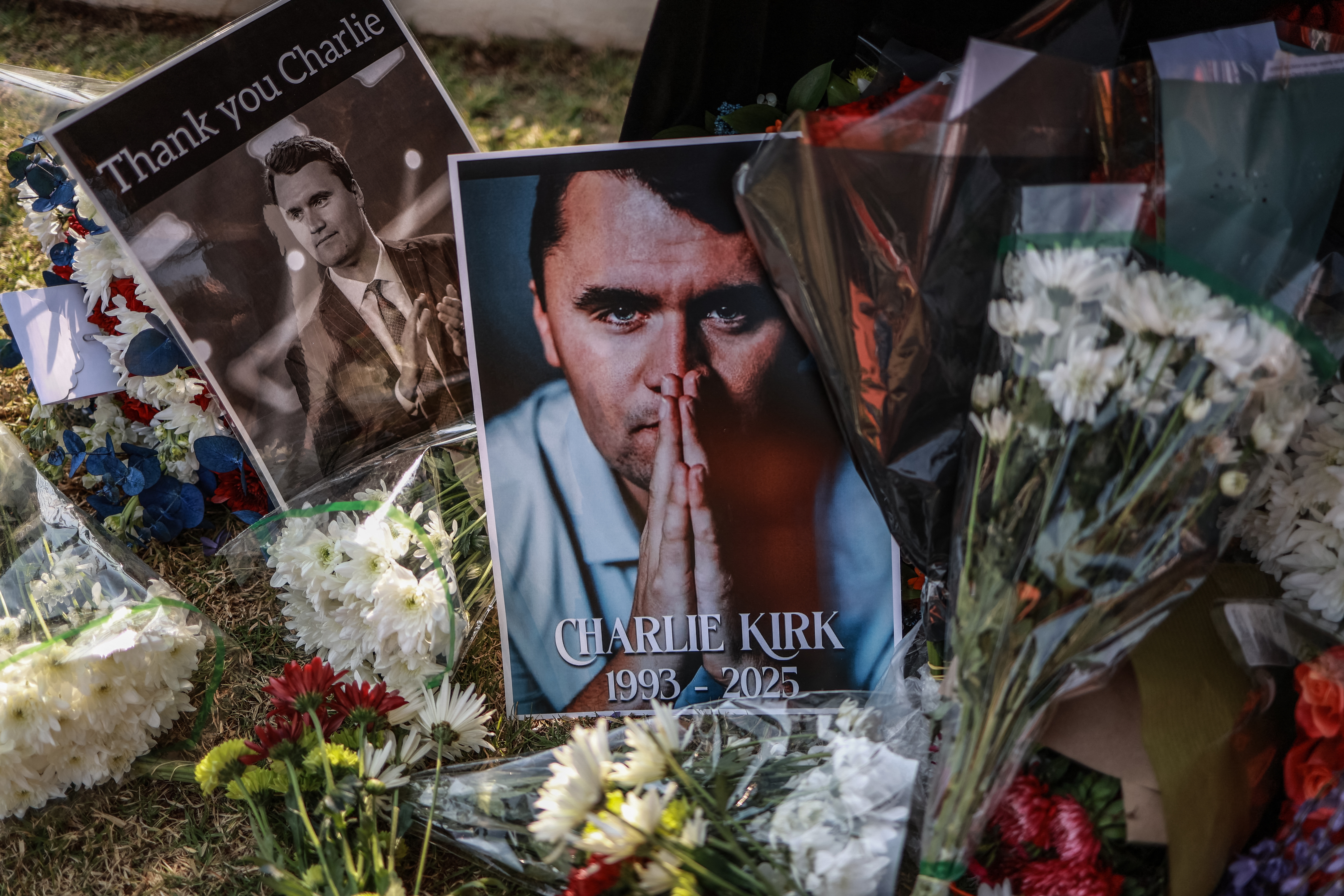 A wreath laid by mourners is seen outside the U.S. Embassy in Pretoria on Sept. 11 following the fatal shooting of Charlie Kirk. A memorial service for Kirk in Arizona on Sunday is expected to draw tens of thousands of supporters.